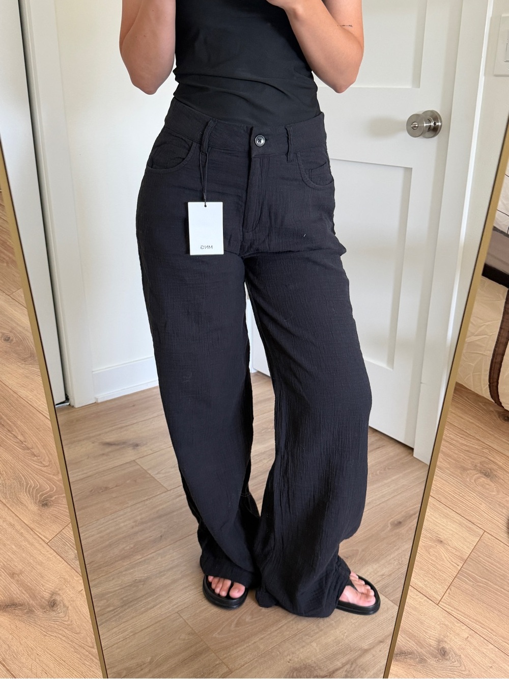 straight-leg crinkle trousers with a mid-rise